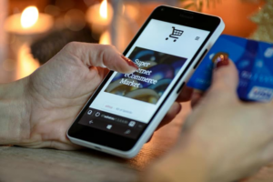 a woman using her phone to make a purchase